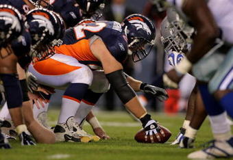 DENVER - AUGUST 16:  Center Casey Wiegmann #62 of the Denver Broncos prepares to snap the ball against the Dallas Cowboys during preseason NFL action at Invesco Field at Mile High on August 16, 2008 in Denver, Colorado. The Broncos defeated the Cowboys 23-13.  (Photo by Doug Pensinger/Getty Images)