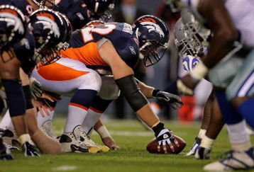 DENVER - AUGUST 16:  Center Casey Wiegmann #62 of the Denver Broncos prepares to snap the ball against the Dallas Cowboys during preseason NFL action at Invesco Field at Mile High on August 16, 2008 in Denver, Colorado. The Broncos defeated the Cowboys 23-13.  (Photo by Doug Pensinger/Getty Images)