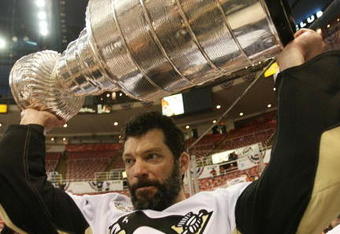 DETROIT - JUNE 12: Bill Guerin #13 of the Pittsburgh Penguins celebrates with the Stanley Cup following the Penguins victory over the Detroit Red Wings in Game Seven of the 2009 NHL Stanley Cup Finals at Joe Louis Arena on June 12, 2009 in Detroit, Michigan. (Photo by Bruce Bennett/Getty Images)