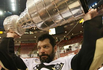 DETROIT - JUNE 12: Bill Guerin #13 of the Pittsburgh Penguins celebrates with the Stanley Cup following the Penguins victory over the Detroit Red Wings in Game Seven of the 2009 NHL Stanley Cup Finals at Joe Louis Arena on June 12, 2009 in Detroit, Michigan. (Photo by Bruce Bennett/Getty Images)
