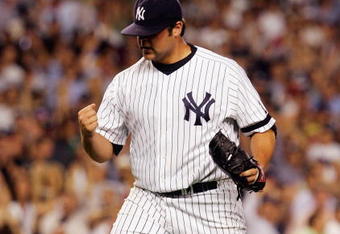 BRONX, NY - AUGUST 28:  Joba Chamberlain #62 of the New York Yankees pumps his fist against the Boston Red Sox during their game at Yankee Stadium on August 28, 2007 in the Bronx, New York. The Yankees won 5-3. (Photo by Jim McIsaac/Getty Images)