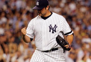 BRONX, NY - AUGUST 28:  Joba Chamberlain #62 of the New York Yankees pumps his fist against the Boston Red Sox during their game at Yankee Stadium on August 28, 2007 in the Bronx, New York. The Yankees won 5-3. (Photo by Jim McIsaac/Getty Images)