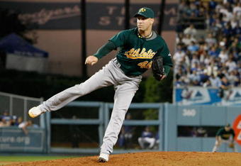 LOS ANGELES, CA - JUNE 16:  Michael Wuertz #48 of the Oakland Athletics pitches against the Los Angeles Dodgers at Dodger Stadium on June 16, 2009 in Los Angeles, California.  (Photo by Jeff Gross/Getty Images)