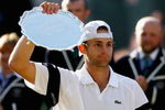 WIMBLEDON, ENGLAND - JULY 05:  Andy Roddick of USA looks despondent after defeat during the men's singles final match against Roger Federer of Switzerland on Day Thirteen of the Wimbledon Lawn Tennis Championships at the All England Lawn Tennis and Croquet Club on July 5, 2009 in London, England. Federer won 5-7, 7-6, 7-6, 3-6, 16-14.  (Photo by Paul Gilham/Getty Images)