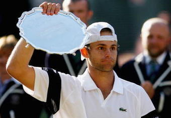 WIMBLEDON, ENGLAND - JULY 05:  Andy Roddick of USA looks despondent after defeat during the men's singles final match against Roger Federer of Switzerland on Day Thirteen of the Wimbledon Lawn Tennis Championships at the All England Lawn Tennis and Croquet Club on July 5, 2009 in London, England. Federer won 5-7, 7-6, 7-6, 3-6, 16-14.  (Photo by Paul Gilham/Getty Images)