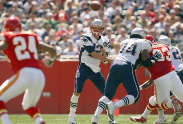 FOXBORO, MA - SEPTEMBER 7:  Quarterback Tom Brady #12 of the New England Patriots passes the ball up the middle during their NFL game against the Kansas City Chiefs on September 7, 2008 at Gillette Stadium in Foxboro, Massachusetts. The Patriots defeated the Chiefs 17-10. (Photo by Elsa Garrison/Getty Images)