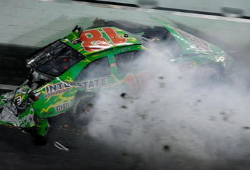 DAYTONA BEACH, FL - JULY 04:  Kyle Busch, driver of the #18 Interstate Batteries Toyota, crashes on the final lap during the NASCAR Sprint Cup Series 51st Annual Coke Zero 400 at Daytona International Speedway on July 4, 2009 in Daytona Beach, Florida.  (Photo by Sam Greenwood/Getty Images)