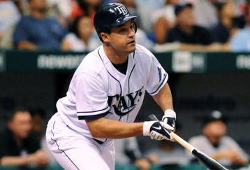 ST. PETERSBURG, FL - APRIL 15: Designed hitter Pat Burrell #5 of the Tampa Bay Rays bats against the New York Yankees at Tropicana Field on April 15, 2009 in St. Petersburg, Florida. All Major League Baseball players are wearing #42 in honor of Jackie Robinson day. (Photo by Al Messerschmidt/Getty Images)