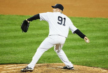 NEW YORK - JUNE 18:  Alfredo Aceves #91 of The New York Yankees pitches against The Washington Nationals during their game on June 18th, 2009 at Yankee Stadium in the Bronx Borough of New York.  (Photo by Al Bello/Getty Images)