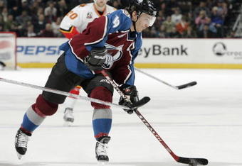 DENVER - JANUARY 24:  Joe Sakic #19 of the Colorado Avalanche takes a shot on goal against the Calgary Flames in the first period on January 24, 2006 at the Pepsi Center in Denver, Colorado. The Avalanche won 7-4.  (Photo by Brian Bahr/Getty Images)