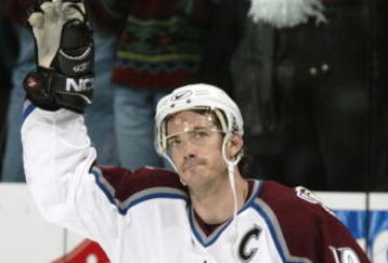 20 Apr 2002:  Joe Sakic #19 of the Colorado Avalanche waves to the crowd after being named the number one star against the Los Angeles Kings with two goals and an assist during game two of their first round playoff series at the Pepsi Center in Denver, Colorado. The Avalanche won 5-3, to go up two games to none. DIGITAL IMAGE Mandatory Credit: Brian Bahr/Getty Images/NHLI