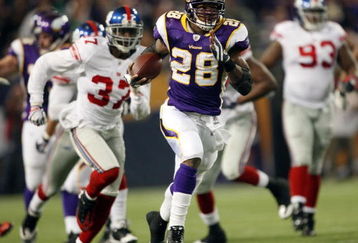MINNEAPOLIS - DECEMBER 28:   Adrian Peterson #28 of the Minnesota Vikings runs the ball in for a touchdown as James Butler of the New York Giants defends on December 28, 2008 at the Hubert H. Humphrey Metrodome in Minneapolis, Minnesota. The Vikings defeated the Giants 20-19. (Photo by Elsa/Getty Images)