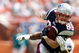 MIAMI - NOVEMBER 23: Wide receiver Wes Welker #83 of the New England Patriots breaks free from a tackle attempt by linebacker Akin Ayodele #51 of the Miami Dolphins at Dolphin Stadium on November 23, 2008 in Miami, Florida. (Photo by Doug Benc/Getty Images)