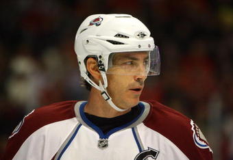 CHICAGO - NOVEMBER 03:  Joe Sakic #19 of the Colorado Avalanche looks on against the Chicago Blackhawks at the United Center on November 3, 2008 in Chicago, Illinois.  (Photo by Jeff Gross/Getty Images)