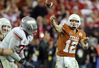 GLENDALE, AZ - JANUARY 05:  Quarterback Colt McCoy #12 of the Texas Longhorns throws a pass against the Ohio State Buckeyes during the Tostitos Fiesta Bowl Game on January 5, 2009 at University of Phoenix Stadium in Glendale, Arizona.   The Longhorns defeated the Buckeyes 24-21.  (Photo by Jed Jacobsohn/Getty Images)