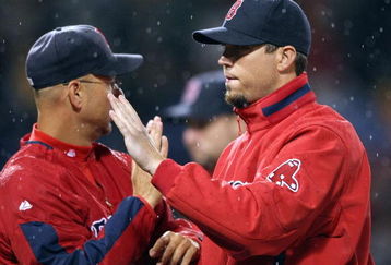 BOSTON - JULY 07:  Josh Beckett #19 of the Boston Red Sox celebrates the win with manager Terry Francona #47 after the game against the Oakland Athletics on July 7, 2009 at Fenway Park in Boston, Massachusetts. The Red Sox defeated the Athletics 5-2.  (Photo by Elsa/Getty Images)