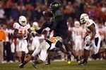 SAN DIEGO, CA - DECEMBER 30:   Runningback LeGarrette Blount #9 of the University of Oregon Ducks hurdles a player en route to a touchdown during his team's 42-31 win over the Oklahoma State University Cowboys in the Pacific Life Holiday Bowl at Qualcomm Stadium on December 30, 2008 in San Diego, California. (Photo by Donald Miralle/Getty Images)