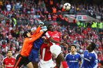 LONDON - APRIL 18:  Petr Cech of Chelsea punches clear from Kolo Toure of Arsenal during the FA Cup sponsored by E.ON Semi Final match between Arsenal and Chelsea at Wembley Stadium on April 18, 2009 in London, England.  (Photo by Phil Cole/Getty Images)