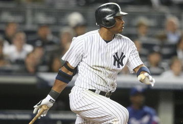 NEW YORK - JUNE 03:  Robinson Cano #24 of the New York Yankees bats against the Texas Rangers on June 3, 2009 at Yankee Stadium in the Bronx borough of New York City.  (Photo by Nick Laham/Getty Images)