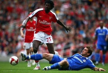 LONDON - MAY 10:  Emmanuel Adebayor of Arsenal is tackled by Branislav Ivanovic of Chelsea during the Barclays Premier League match between Arsenal and Chelsea at the Emirates Stadium on May 10, 2009 in London, England.  (Photo by Jamie McDonald/Getty Images)