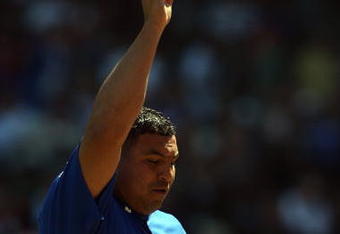 CHICAGO - APRIL 17:  Carlos Zambrano #38 of the Chicago Cubs points to the sky during the game against the St. Louis Cardinals on April 17, 2009 at Wrigley Field in Chicago, Illinois. (Photo by Jonathan Daniel/Getty Images) 