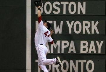 BOSTON - JULY 06:  Jason Bay #44 of the Boston Red Sox makes a catch against the Oakland Athletics at Fenway Park on July 6, 2009 in Boston, Massachusetts. (Photo by Elsa/Getty Images)