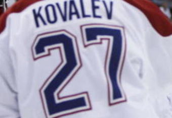 RALEIGH, NC - APRIL 22:  Alex Kovalev #27 of the Montreal Canadiens is congratulated by teammate Tomas Plekanec #35 after Kovalev scored a goal in the second period against the Carolina Hurricanes in game one of the Eastern Conference Quarterfinals during the 2006 NHL Playoffs at RBC Center on April 22, 2006 in Raleigh, North Carolina.  (Photo by Doug Benc/Getty Images)
