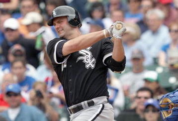CHICAGO - JUNE 17: Paul Konerko #14 of the Chicago White Sox swings at the pitch against the Chicago Cubs on June 17, 2009 at Wrigley Field in Chicago, Illinois. (Photo by Jonathan Daniel/Getty Images)