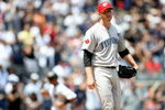 NEW YORK - JULY 04:  Roy Halladay #32 of the Toronto Blue Jays reacts after Jorge Posada #20 of the New York Yankees hit a home run in the fourth inning on July 4, 2009 at Yankee Stadium in the Bronx borough of New York City.  (Photo by Nick Laham/Getty Images)
