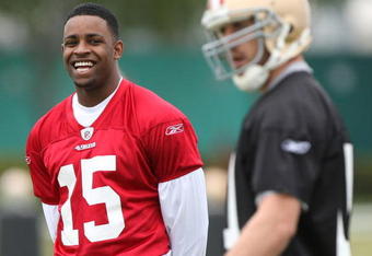 SANTA CLARA, CA - MAY 01:  Michael Crabtree #15 of the San Francisco 49ers looks on during practice as quaterback Alex Smith #11 practices during the 49ers Minicamp at their training facilities on May 1, 2009 in Santa Clara, California. Crabtree was the 49ers first round draft pick.  (Photo by Jed Jacobsohn/Getty Images)