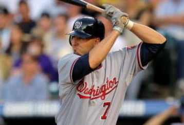 DENVER - JULY 06:  Catcher Josh Bard #7 of the Washington Nationals takes an at bat against the Colorado Rockies during MLB action at Coors Field on July 6, 2009 in Denver, Colorado. The Rockies defeated the Nationals 1-0.  (Photo by Doug Pensinger/Getty Images)