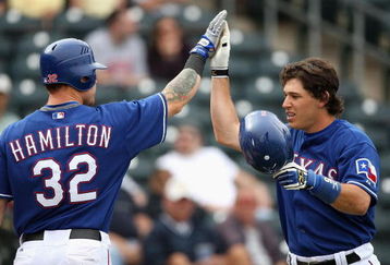 SURPRISE, AZ - MARCH 05:  Ian Kinsler #5 of the Texas Rangers is congratulted by teammate Josh Hamilton #32 after Kinsler hit a two run home run against the San Diego Padres during the fifth inning of the spring training game at Surprise Stadium on March 5, 2009 in Surprise, Arizona. The Rangers defeated the Padres 4-3.  (Photo by Christian Petersen/Getty Images)