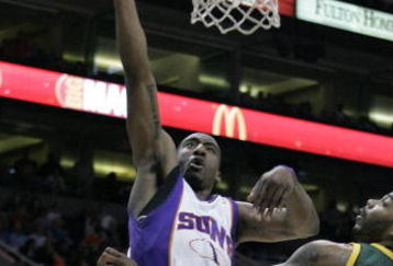 PHOENIX - FEBRUARY 8:  Amare' Stoudemire #1 of the Phoenix Suns lays the ball in against Chris Wilcox #54 of the Seattle SuperSonics on February 8, 2008 at US Airways Center in Phoenix, Arizona. NOTE TO USER: User expressly acknowledges and agrees that, by downloading and or using this Photograph, user is consenting to the terms and conditions of the Getty Images License Agreement.(Photo by Domenic Centofanti/Getty Images)