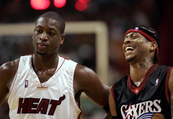 MIAMI - NOVEMBER 18: Guard Dwyane Wade #3 of the Miami Heat stands by Guard Allen Iverson #3 of the Philadelphia 76ers while laughing on November 18, 2005 at the American Airlines Arena in Miami  Florida. NOTE TO USER: User expressly acknowledges and agrees that, by downloading and or using this photograph, User is consenting to the terms and conditions of the Getty Images License Agreement. (Photo by Eliot J. Schechter/Getty Images) 