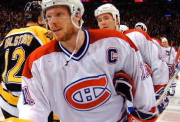 29 Apr 2002:   Captin Saku Koivu #11 of the Montreal Canadiens and P.J. Axelsson #11 of the Boston Bruins take part in the traditional handshake after game six of the Eastern Conference Quarter Finals between the Boston Bruins and the Montreal Canadiensat the Molson Centre in Montreal, Canada.The Canadiens won the game 2-1. DIGITAL IMAGE. Mandatory Credit:  Dave Sandford/Getty Images/NHLI