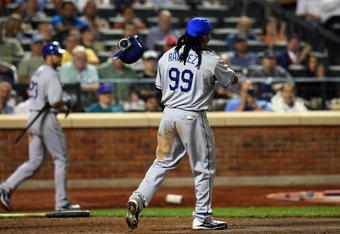 NEW YORK - JULY 07:  Manny Ramirez #99 of the Los Angeles Dodgers reacts after striking out in the fifth inning against the New York Mets on July 7, 2009 at Citi Field in the Flushing neighborhood of the Queens borough of New York City.  (Photo by Jim McIsaac/Getty Images)
