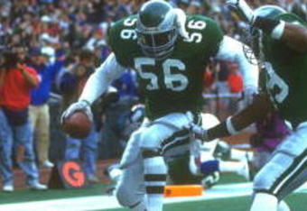 25 NOV 1990:  PHILADELPHIA EAGLES DEFENSEMAN BYRON EVANS #56 PERFORMS A DANCE IN THE ENDZONE AFTER RECOVERING A TURN OVER THAT RESULTED IN A TOUCHDOWN DURING THE EAGLES 31-13 WIN OVER THE NEW YORK GIANTS AT GIANTS STADIUM IN EAST RUTHERFORD, NEW JERSEY.