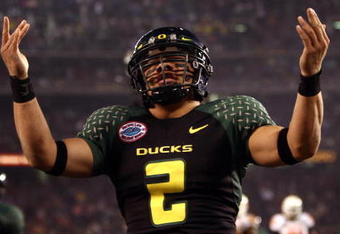 SAN DIEGO, CA - DECEMBER 30:   Quarterback Jeremiah Masoli #2 of the University of Oregon Ducks runs into the endzone for a touchdown against the Oklahoma State University Cowboys during the Pacific Life Holiday Bowl at Qualcomm Stadium on December 30, 2008 in San Diego, California. The Ducks won 42-31. (Photo by Donald Miralle/Getty Images)