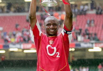 CARDIFF, UNITED KINGDOM - MAY 21:  Captain, Patrick Vieira of Arsenal holds aloft the trophy after winning the FA Cup Final between Arsenal and Manchester United 5-4 on penalty's at The Millennium Stadium on May 21, 2005 in Cardiff, Wales.  (Photo by Ross Kinnaird/Getty Images)