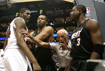 ATLANTA - APRIL 29:  Official Dick Bavetta #27 steps in between Dwyane Wade #3, Jamaal Magloire #21 of the Miami Heat and Solomon Jones #44 of the Atlanta Hawks after Wade was fouled hard during Game Five of the Eastern Conference Quarterfinals at Philips Arena on April 29, 2009 in Atlanta, Georgia. NOTE TO USER: User expressly acknowledges and agrees that, by downloading and/or using this Photograph, user is consenting to the terms and conditions of the Getty Images License Agreement.  (Photo by Doug Benc/Getty Images)