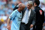 MANCHESTER, ENGLAND - MAY 24:  Mark Hughes the Man City manager greets Stephen Ireland as he is subsituted during the Barclays Premier League match between Manchester City and Bolton Wanderers at the City of Manchester Stadium on May 24, 2009 in Manchester, England.  (Photo by Richard Heathcote/Getty Images)