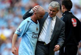 MANCHESTER, ENGLAND - MAY 24:  Mark Hughes the Man City manager greets Stephen Ireland as he is subsituted during the Barclays Premier League match between Manchester City and Bolton Wanderers at the City of Manchester Stadium on May 24, 2009 in Manchester, England.  (Photo by Richard Heathcote/Getty Images)