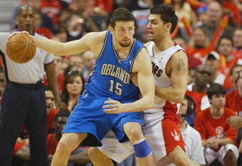 TORONTO, ON - APRIL 26:  Hedo Turkoglu #15 of the Orlando Magic tries to get outside of Carlos Delfino #20 of the Toronto Raptors in Game Four of the Eastern Conference Quarterfinals at the Air Canada Centre April 26, 2008 in Toronto, Ontario. The Magic defeated the Raptors 106-94 to take a 3-1 series lead.  (Photo by Claus Andersen/Getty Images)