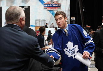 MONTREAL , QC - JUNE 27:  Jesse Blacker greets team representatives after being drafted by the Toronto Maple Leafs during the second day of the 2009 NHL Entry Draft at the Bell Centre on June 27, 2009 in Montreal, Quebec, Canada. (Photo by Bruce Bennett/Getty Images) 