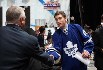 MONTREAL , QC - JUNE 27:  Jesse Blacker greets team representatives after being drafted by the Toronto Maple Leafs during the second day of the 2009 NHL Entry Draft at the Bell Centre on June 27, 2009 in Montreal, Quebec, Canada. (Photo by Bruce Bennett/Getty Images) 