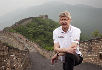 BEIJING, CHINA - JUNE 7:  Arsenal Manager Arsene Wenger poses for a portrait on a visit to the Great Wall of China during his tour of Asia with FIFA World Cup sponsor Castrol, on June 7, 2008 in Beijing, China.  (Photo by Adam Pretty/Getty Images for Castrol)