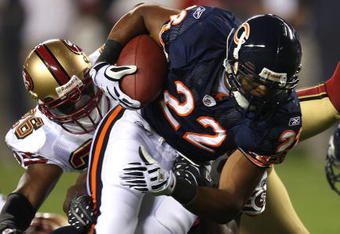 CHICAGO - AUGUST 21:  Matt Forte #22 of the Chicago Bears breaks away from Mark Roman #26 of the San Francisco 49ers on August 21, 2008 at Soldier Field in Chicago, Illinois. The 49ers defeated the Bears 37-30. (Photo by Jonathan Daniel/Getty Images)