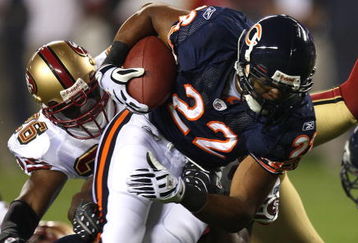 CHICAGO - AUGUST 21:  Matt Forte #22 of the Chicago Bears breaks away from Mark Roman #26 of the San Francisco 49ers on August 21, 2008 at Soldier Field in Chicago, Illinois. The 49ers defeated the Bears 37-30. (Photo by Jonathan Daniel/Getty Images)