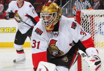 NEWARK, NJ - DECEMBER 19: Goaltender Alex Auld #31 of the Ottawa Senators plays the puck against the New Jersey Devils on December 19, 2008 at the Prudential Center in Newark, New Jersey. (Photo by Bruce Bennett/Getty Images)