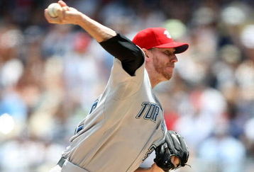 NEW YORK - JULY 04:  Roy Halladay #32 of the Toronto Blue Jays pitches against the New York Yankees on July 4, 2009 at Yankee Stadium in the Bronx borough of New York City.  (Photo by Nick Laham/Getty Images)